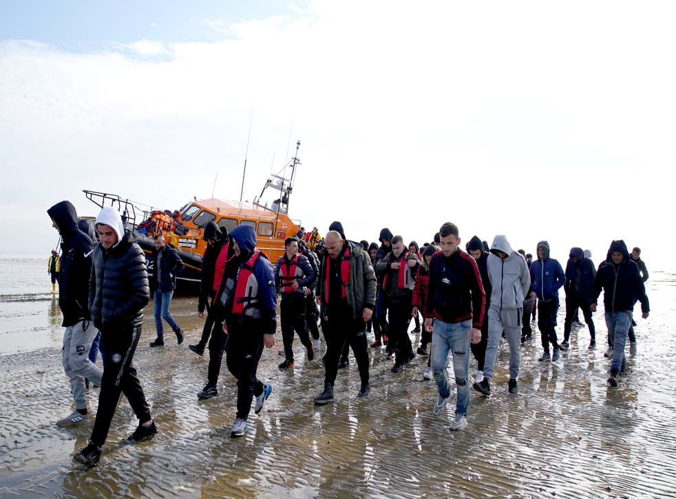 A group of people thought to be migrants are brought in to Dungeness, Kent, onboard the RNLI Dungeness Lifeboat, following a small boat incident in the Channel (Gareth Fuller/PA)