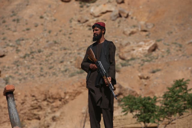 <p>Taliban forces stand guard at the entrances and exits of the Bamyan province in Afghanistan</p>