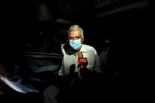 <p>Sri Lanka’s new prime minister Ranil Wickremesinghe visiting a Buddhist temple after his swearing-in ceremony in Colombo</p>
