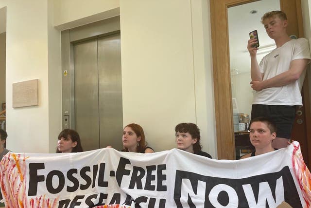 <p>Cambridge University students protest inside the BP Institute in Cambridge in May </p>