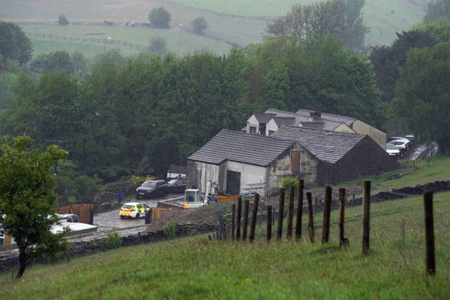Police at a building in Milnrow, Rochdale after a three-year-old boy died after a dog attack (PA)