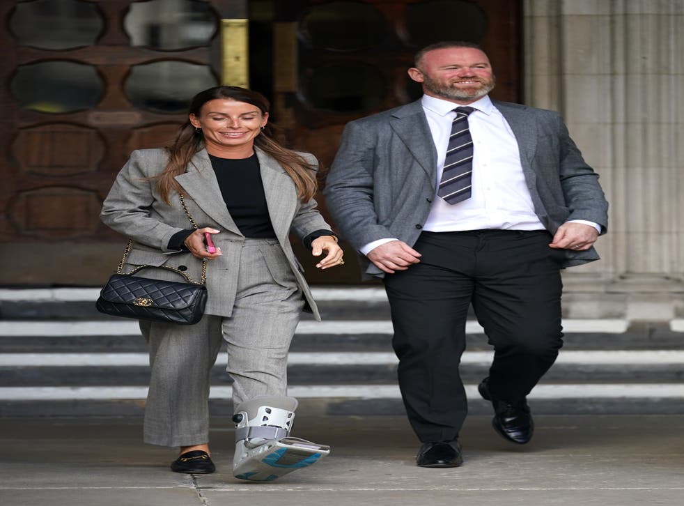 Coleen and Wayne Rooney leaving the Royal Courts Of Justice, London, as the high-profile libel battle between Rebekah Vardy and Coleen Rooney continues. Picture date: Monday May 16, 2022.