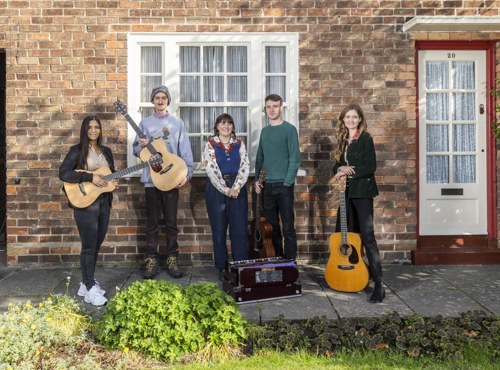 Artists (l-r) Serena Ittoo, Dullan, Humm who are Carys Lewin and Arty Jackson, and Emily Theodora outside 20 Forthlin Road in Liverpool, the childhood home of Paul and Mike McCartney (Fabio De Paola/PA Wire)