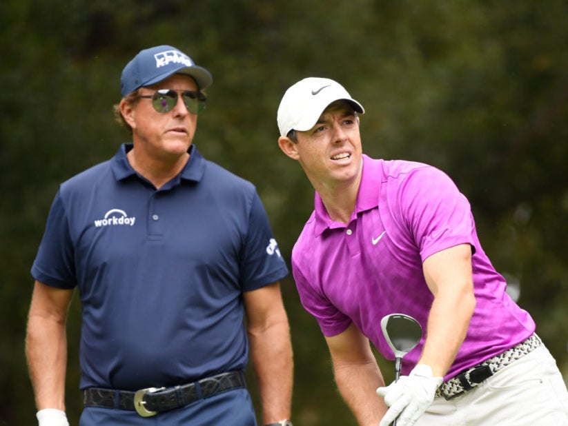 Rory McIlroy (right) has poked fun at a claim made in a book about Phil Mickelson