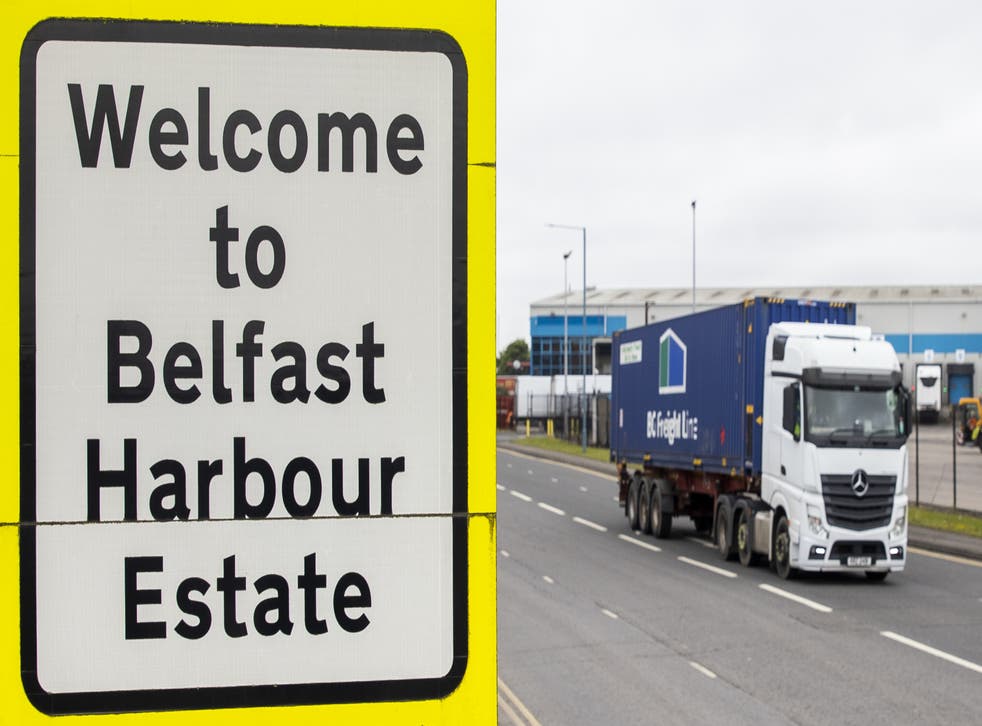 Haulage lorry drives passed a sign at Belfast Port welcoming travellers to the Harbour Estate (Liam McBurney/PA)