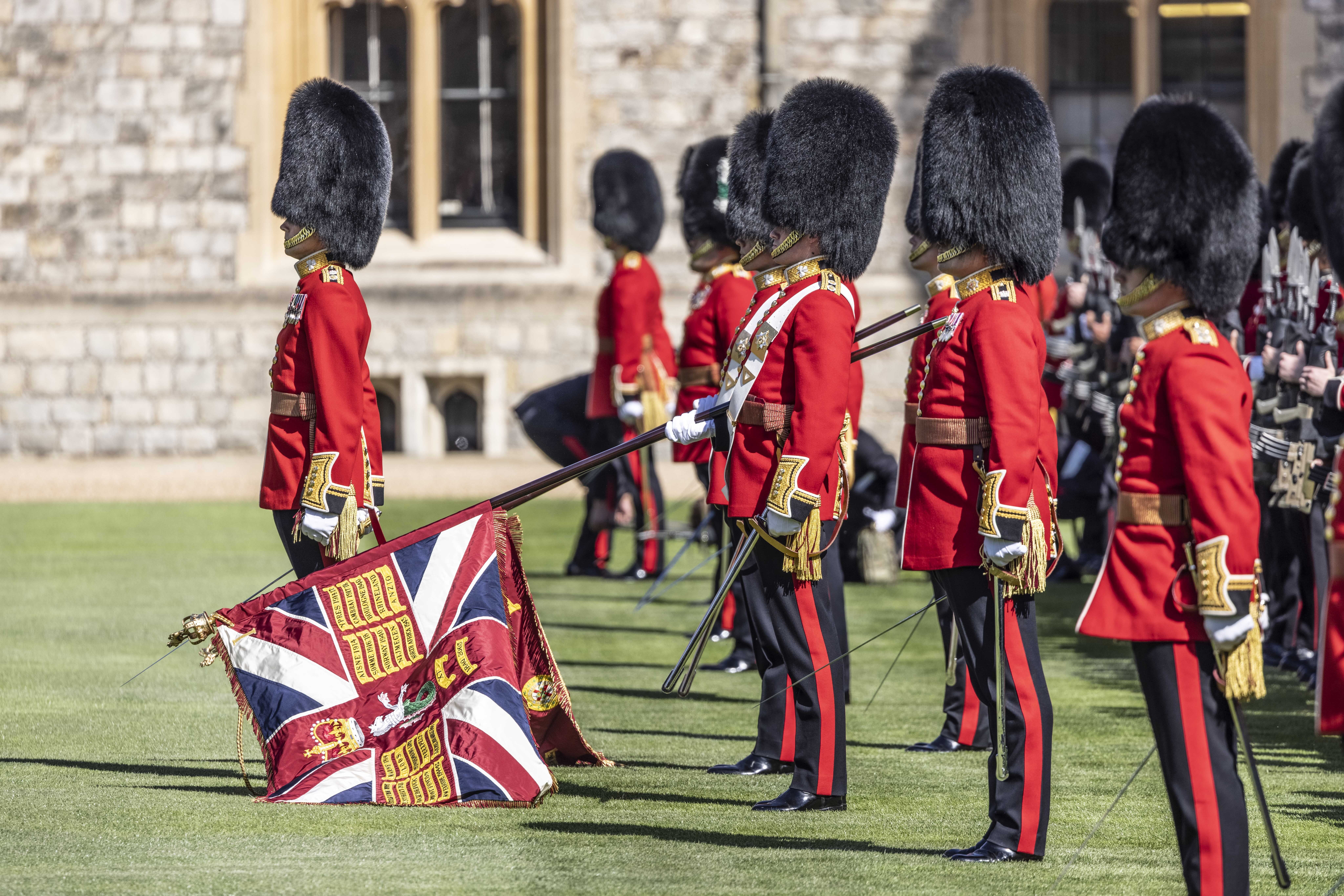 The new regimental colours of the 1st Battalion Irish Guards are paraded in the Quadrangle of Windsor Castle (Richard Pohle/The Times/PA)