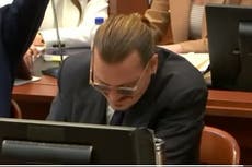 Johnny Depp smiles as Amber Heard’s lawyer impersonates his voice