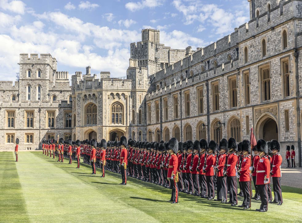 The 1st battalion Irish Guards line up on parade in the Quadrangle of Windsor Castle where their new colours were presented to the regiment by the Duke of Cambridge (Richard Pohle/The Times/PA)