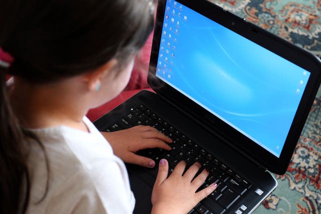 A child using a laptop computer, as some pupils have begun the new school term learning remotely as the Omicron variant causes disruption across the country (PA)