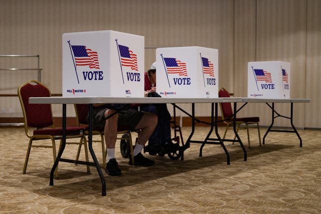 <p>Voters cast their ballots in the Pennsylvania primary elections at Congregation Beth Or in Ambler, Pennsylvania, U.S. May 17, 2022. REUTERS/Hannah Beier</p>