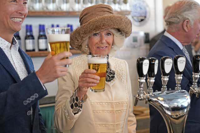The Prince of Wales and Duchess of Cornwall celebrated the culture, crafts and people of Canada as they poured themselves pints of beer made from icebergs thousands of years old (Jacob King/PA)
