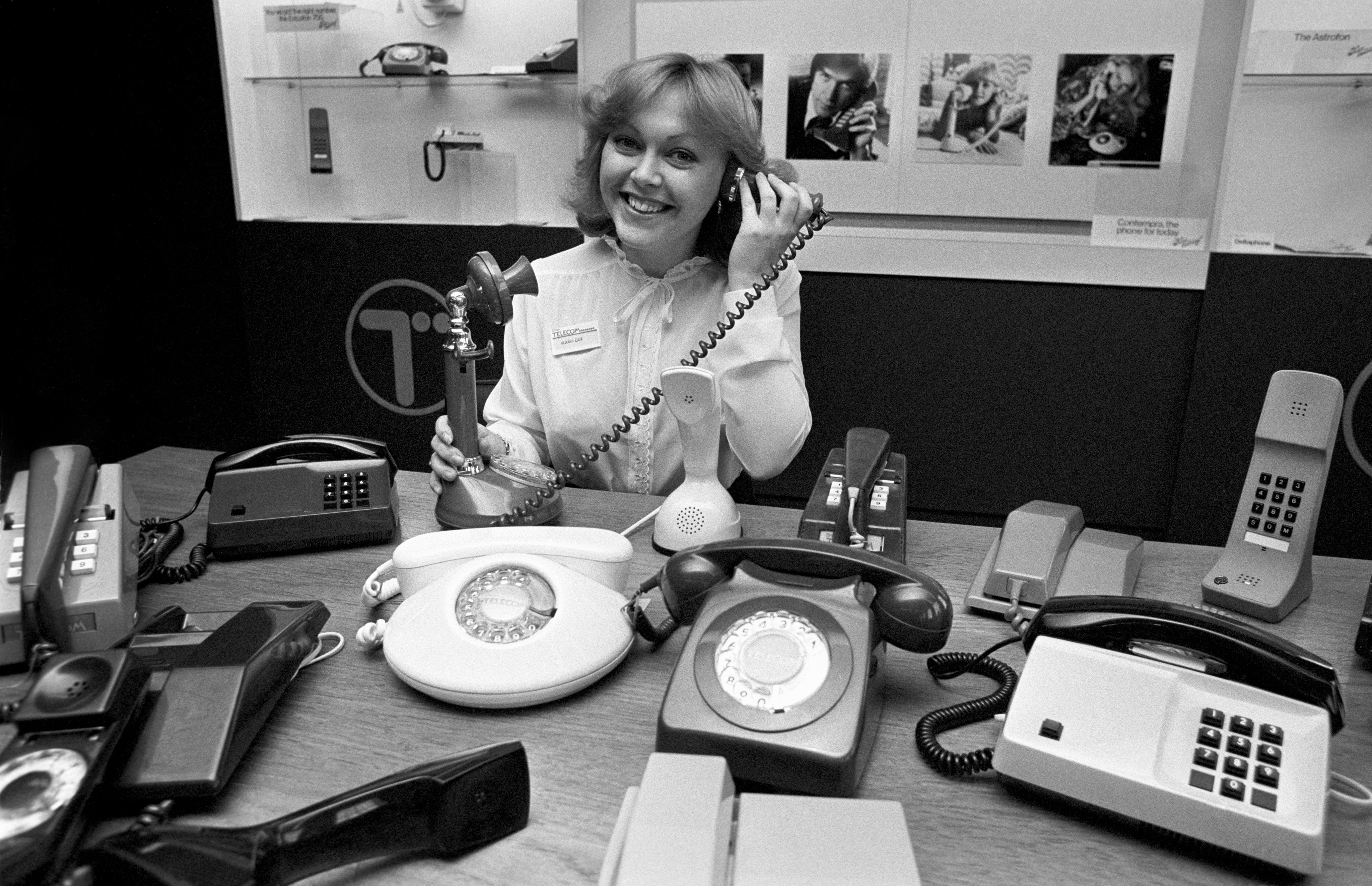 Sales officer Deborah Eden demonstrates the latest range of British Telecom telephones in November 1981 (PA)