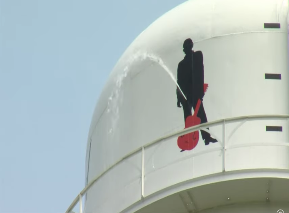 <p>A Johnny Cash mural on a water tower was vandalised in the rock star’s hometown of Kingsland, Arkansas</p>