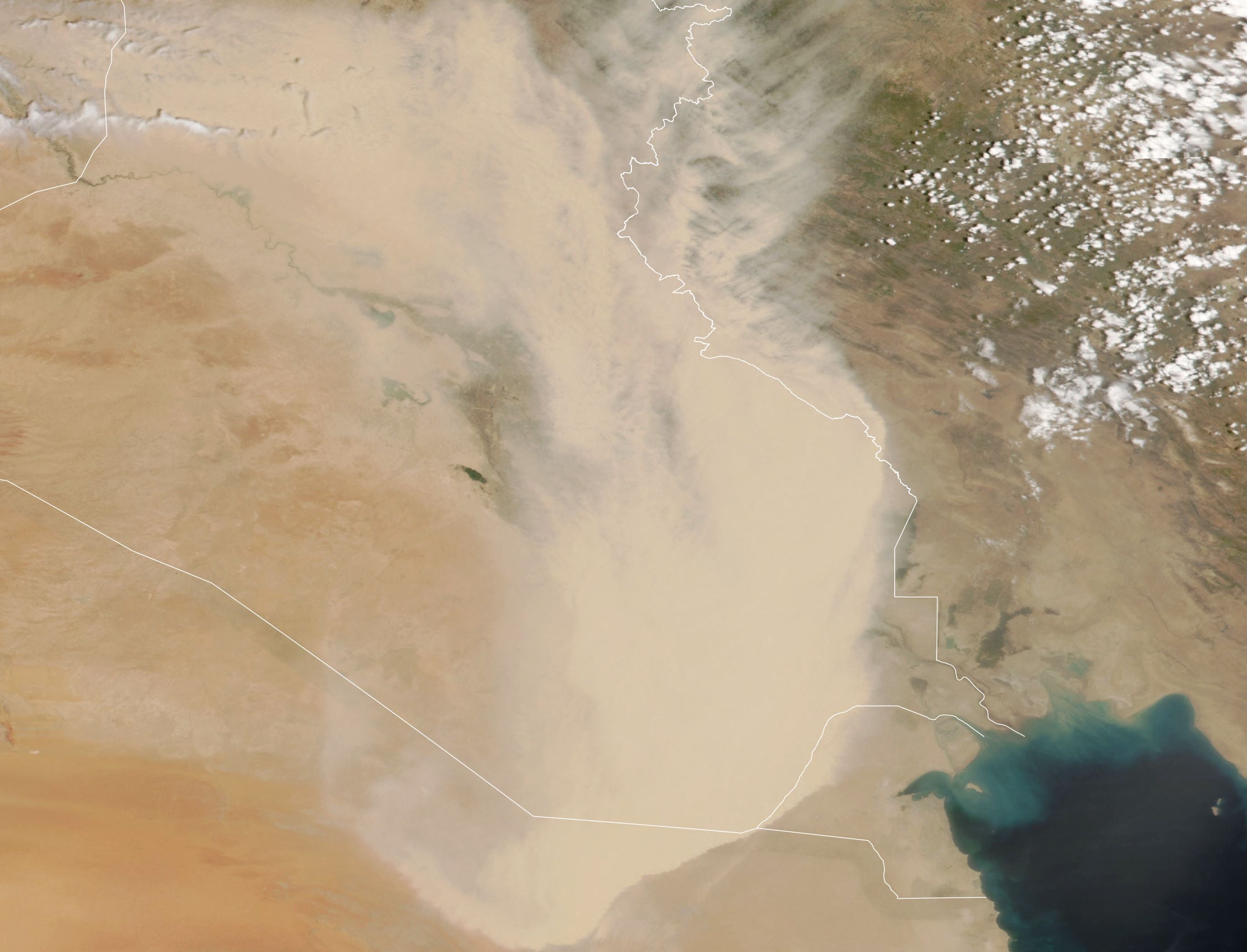 In this handout satellite image courtesy of NASA Earth Observatory taken on 16 May 2022, a dust storm engulfs parts of Iraq and neighbouring countries