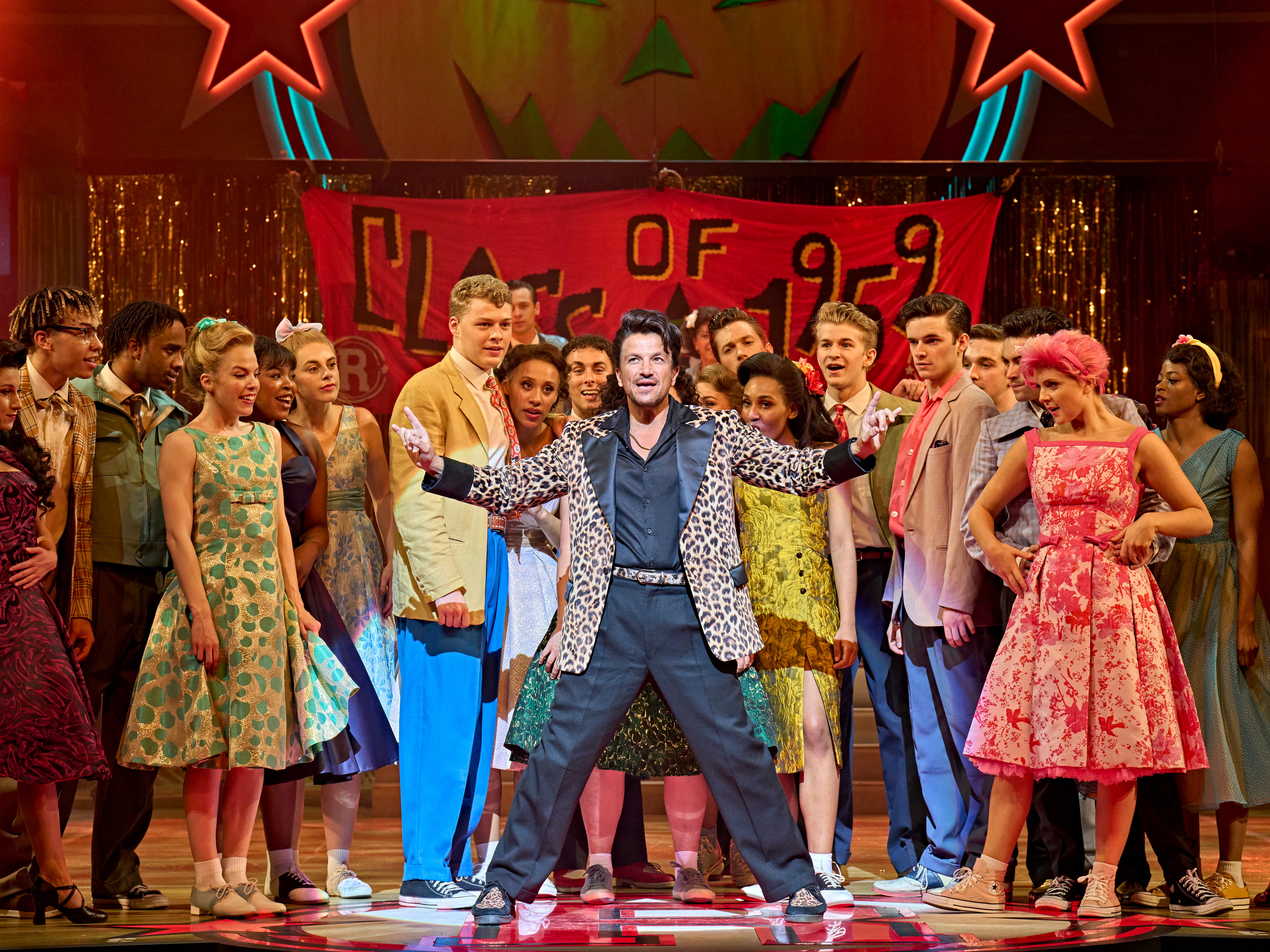 Peter Andre as Vince Fontaine (centre) with the company in ‘Grease’