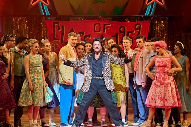 <p>Peter Andre as Vince Fontaine (centre) with the company in ‘Grease’ </p>