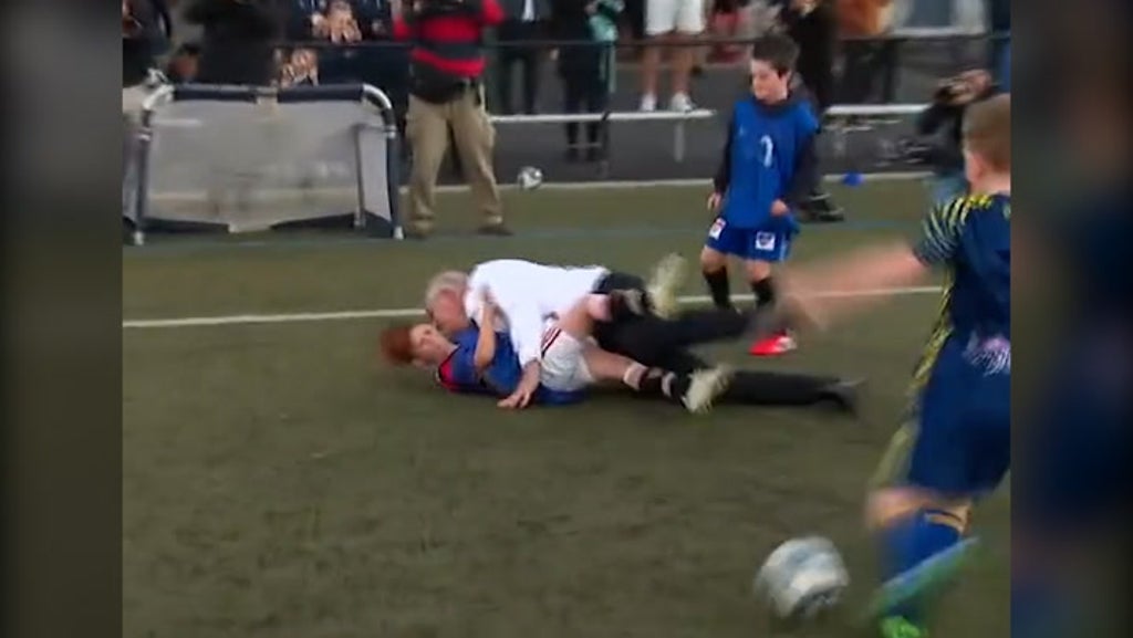 Australia PM Scott Morrison flattens schoolboy during football match in Tasmania