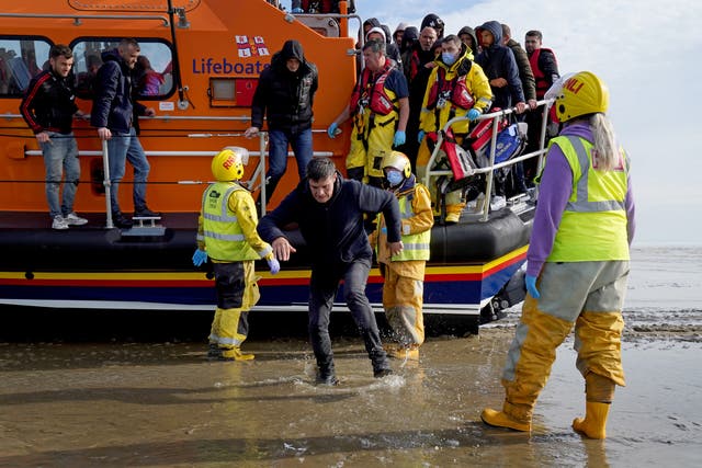 A group of people thought to be migrants are brought into Dungeness, Kent (Gareth Fuller/PA)