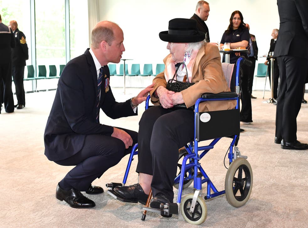 The Duke of Cambridge speaks with 100-year-old Diana Mayes, who was widowed in 1943, during the unveiling of a submariners memorial at the National Memorial Arboretum in Staffordshire (Anthony Devlin/PA)