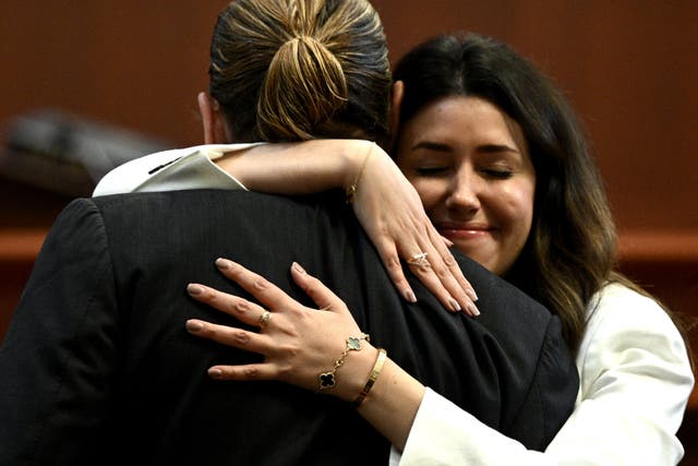 <p>Attorney Camille Vasquez embraces US actor Johnny Depp in the courtroom at the Fairfax County Circuit Courthouse in Fairfax, Virginia, on May 17, 2022.</p>