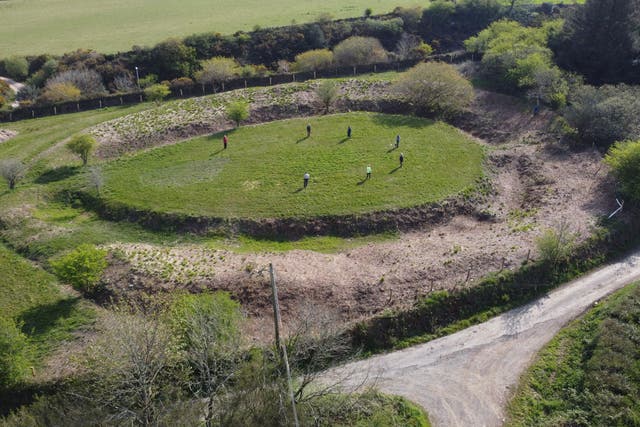 Volunteers mark out the perimeter of a newly discovered stone circle in Cornwall (Historic England/CAU/PA)