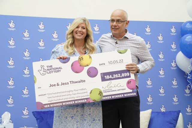 Joe Thwaite, 49, and Jess Thwaite, 46, from Gloucestershire celebrate after winning the record-breaking EuroMillions jackpot of £184 million (Andrew Matthews/PA)