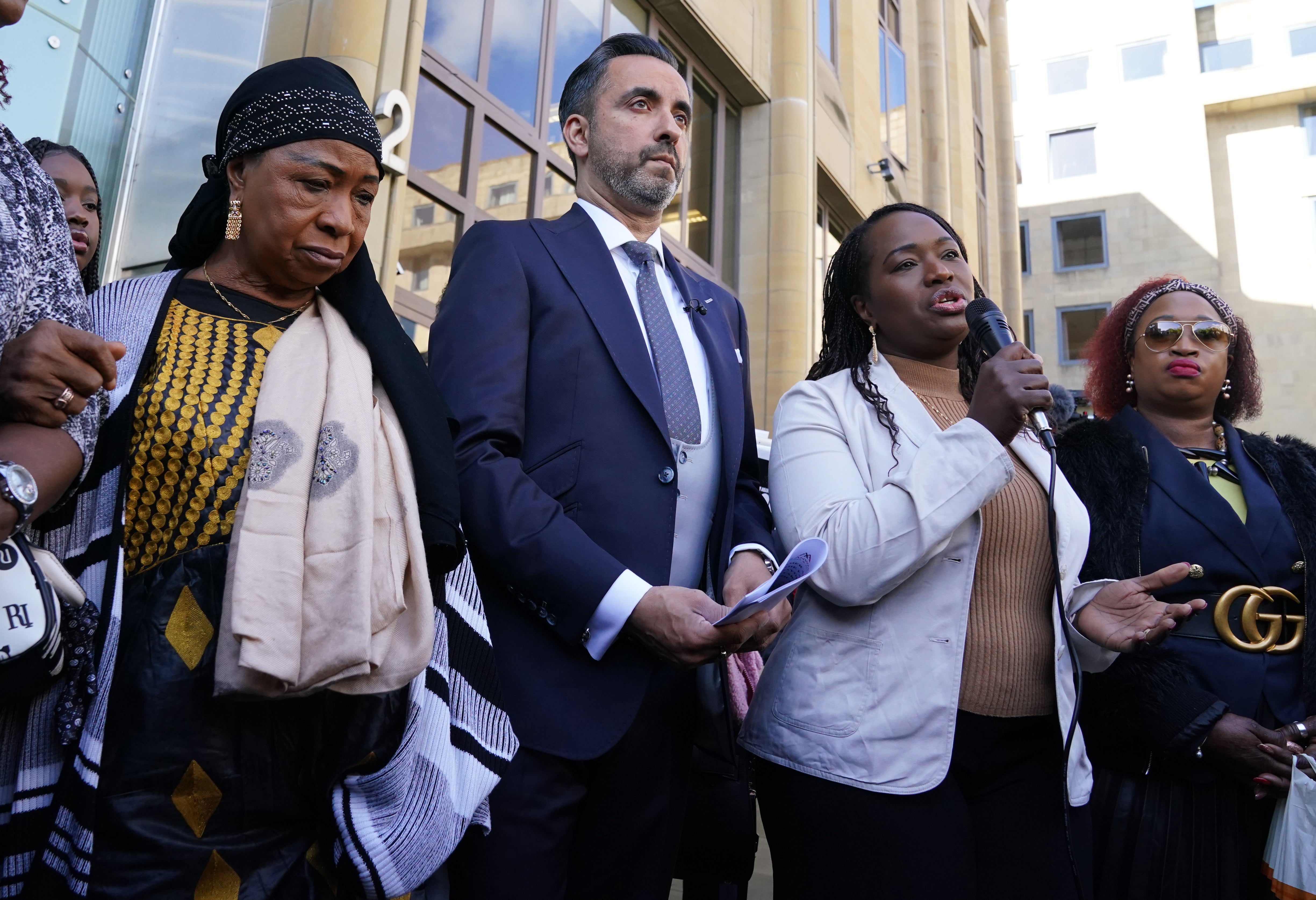 Sheku’s Bayoh’s mother and sisters with lawyer Aamer Anwar outside the inquiry (Andrew Milligan/PA)