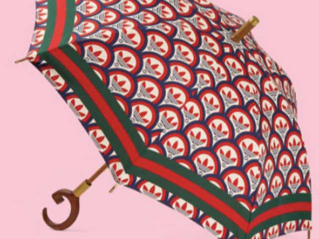 <p>The green and red sun umbrella is a part of a joint Adidas x Gucci collection</p>
