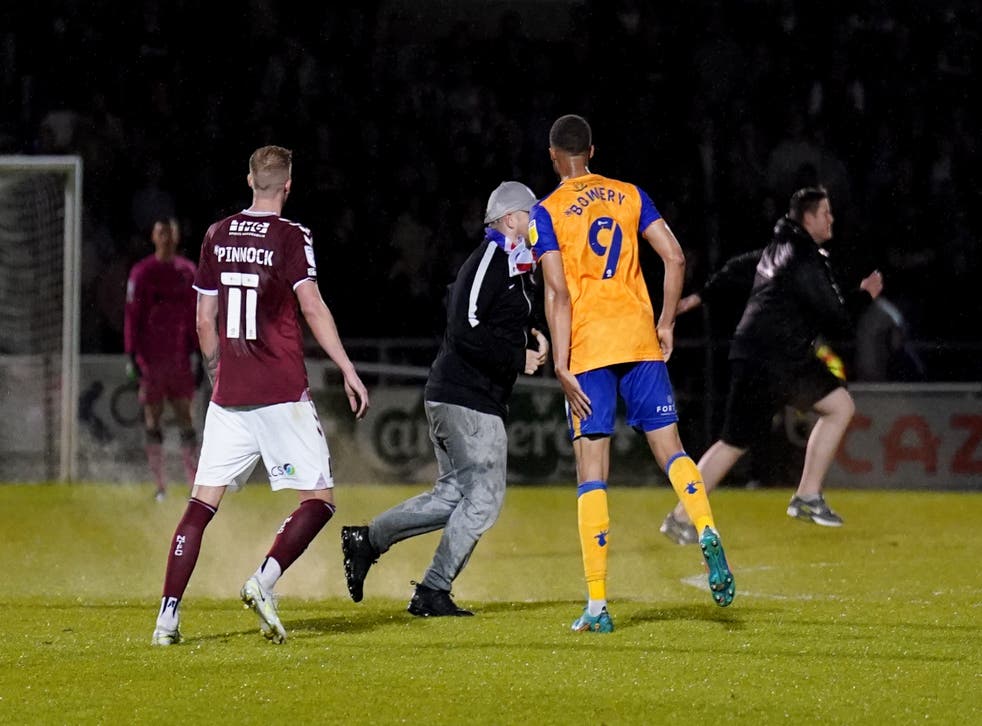 EFL play-offs marred by more disorder as pitch invader barges into Mansfield player | The Independent