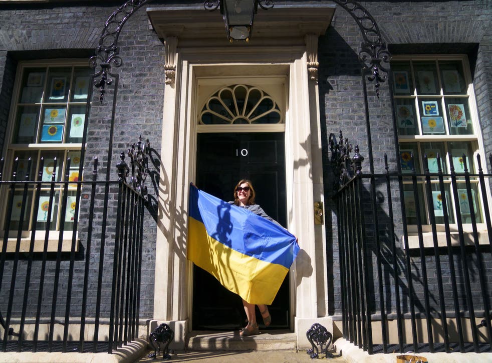 A Ukrainian refugee stands on the doorstep of 10 Downing Street after meeting Prime Minister Boris Johnson (Victoria Jones/PA)