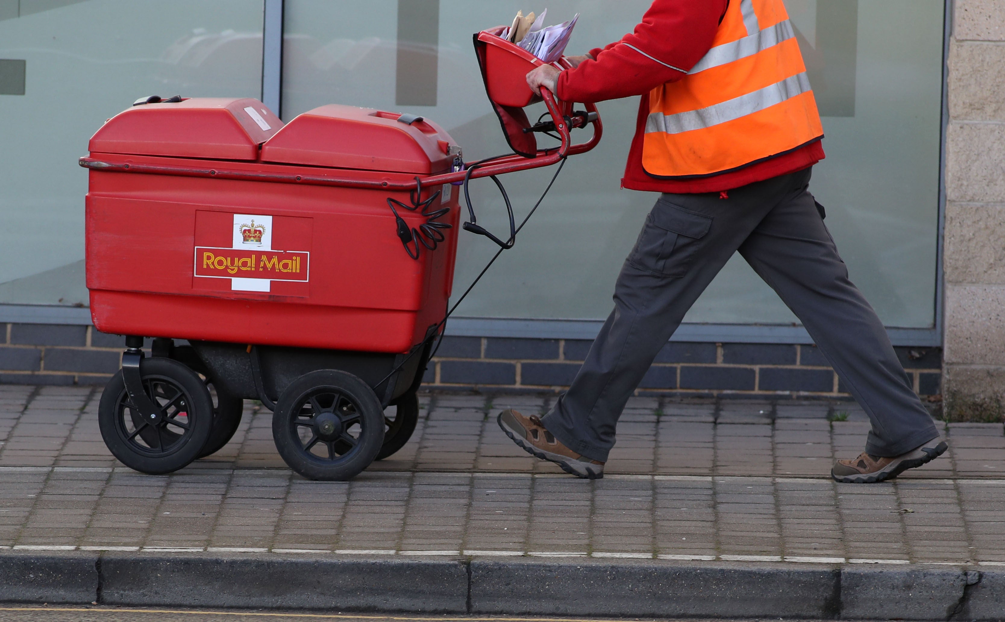 Royal Mail plunged lower after it cautioned over possible further price hikes (PA)