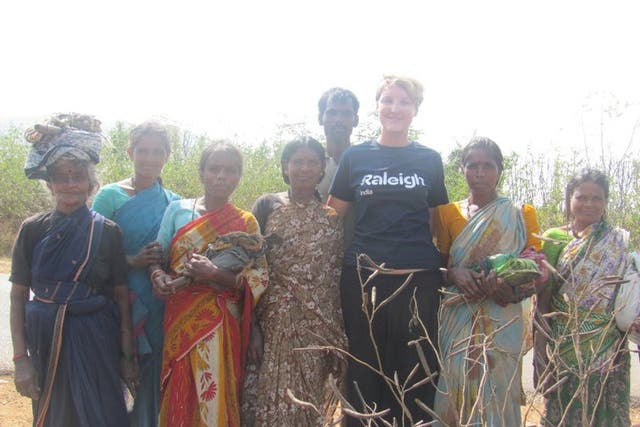 <p>Becky Barnes pictured with members of the local community in south India on a Raleigh International project in 2011</p>