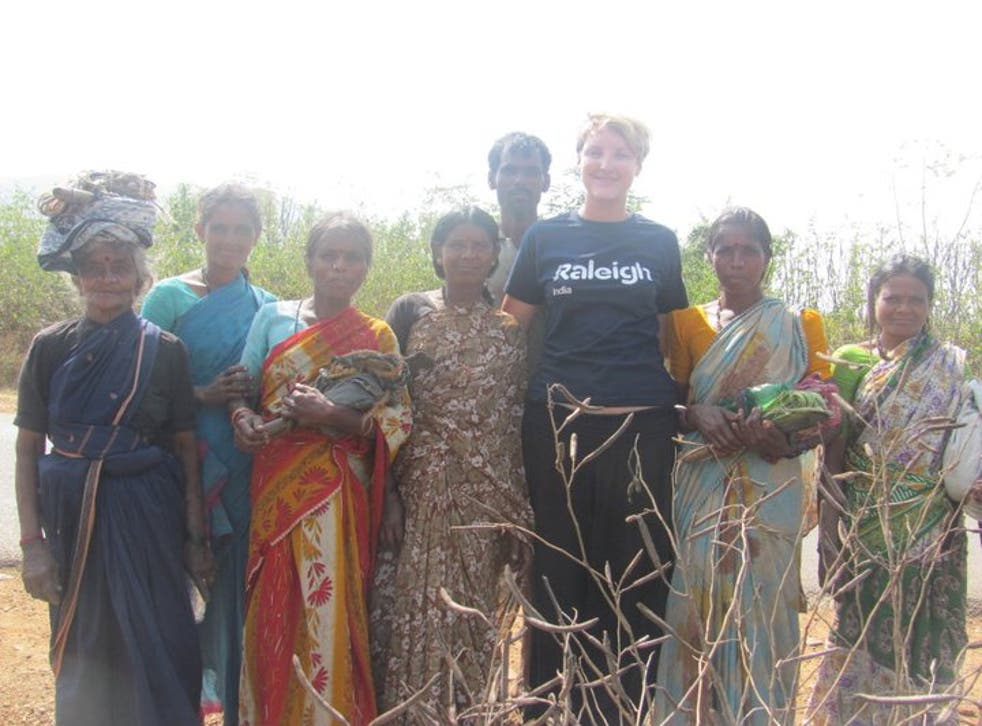 <p>Becky Barnes pictured with members of the local community in south India on a Raleigh International project in 2011</p>