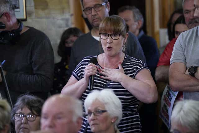 Aundrea Watson asks a question during the parish council meeting (Danny Lawson/PA)