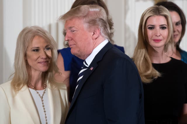 <p>US President Donald Trump walks past his daughter Ivanka Trump (R) and Kellyanne Conway (L), White House Counselor, during an event in honor of Military Mothers and Spousesin May 2018 </p>