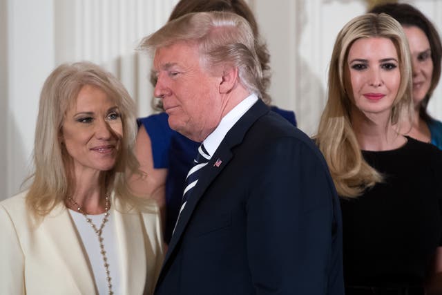 <p>US President Donald Trump walks past his daughter Ivanka Trump (R) and Kellyanne Conway (L), White House Counselor, during an event in honor of Military Mothers and Spousesin May 2018 </p>