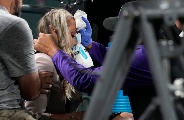 <p>Colorado Rockies television reporter Kelsey Wingert is attended to after being hit by a foul ball off the bat of San Francisco Giants' Austin Slater in the ninth inning of a baseball game Monday, May 16, 2022, in Denver.</p>