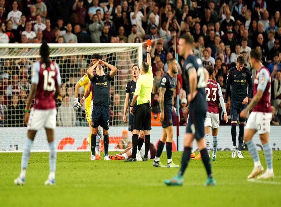 Burnley’s Matt Lowton reacts as he is shown a red card (Mike Egerton/PA)