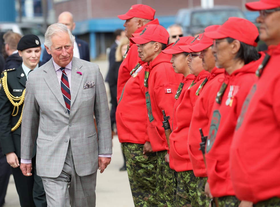 The Prince of Wales tried out a snowmobile for size and marvelled at its modern creature comfort of heated handles when he met Canadian Rangers (Chris Jackson/PA)