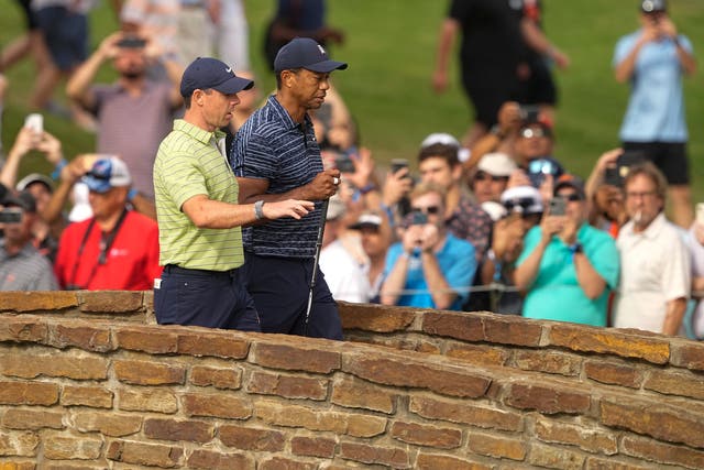 Rory McIlroy headed into the 2nd round of the US PGA Championship nine shots ahead of playing partner Tiger Woods (Matt York/AP)