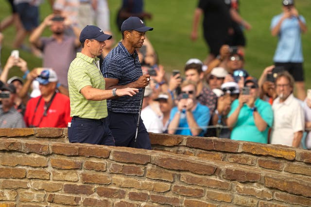Rory McIlroy headed into the 2nd round of the US PGA Championship nine shots ahead of playing partner Tiger Woods (Matt York/AP)