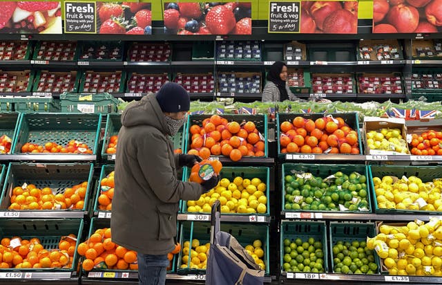 <p>Photo of a customer shopping at a supermarket in London </p>