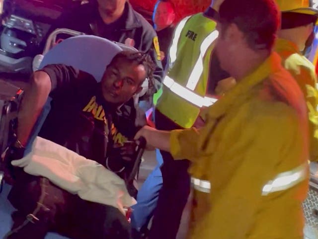 <p>File: A man, identified as Isaiah Lee, is transported into an ambulance after comedian Dave Chappelle was attacked on stage during his stand-up Netflix show </p>