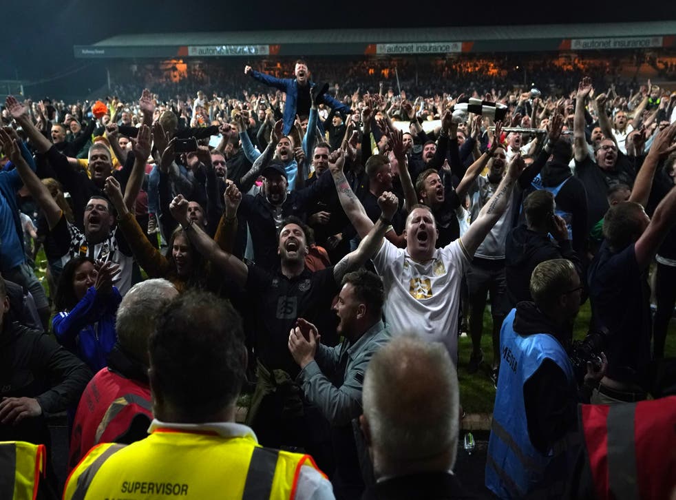 Port Vale fans invaded the pitch after victory in a penalty shoot-out against Swindon (Nick Potts/PA)