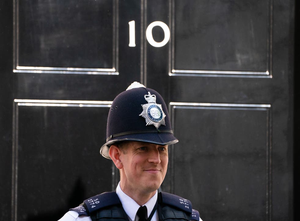 A Metropolitan Police officer stands outside 10 Downing Street (Dominic Lipinski/PA)