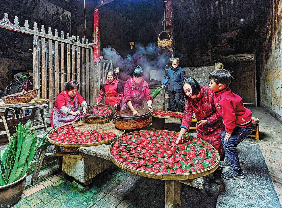 <p>Chen Ying’s picture, <em>Traditional Skill,</em> won the Food for Celebration category with its depiction of a family in China’s Fujian province making traditional food for Chinese New Year</p>