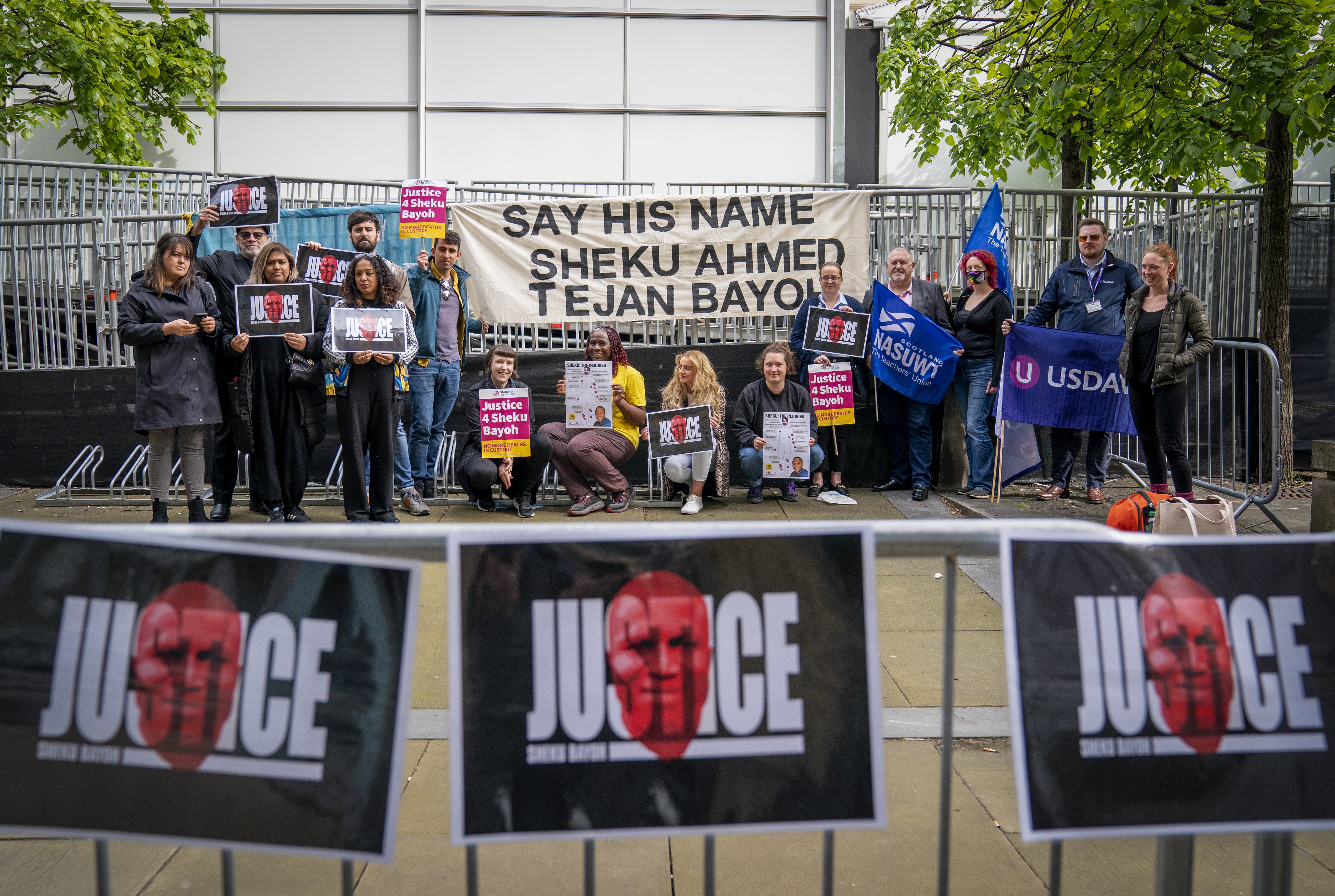 Supporters of the Bayoh family gather outside the inquiry in Edinburgh (Jane Barlow/PA)