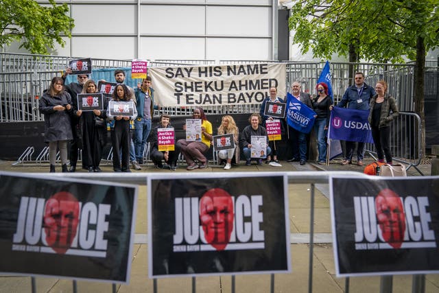 Supporters of the Bayoh family gather outside the inquiry in Edinburgh (Jane Barlow/PA)