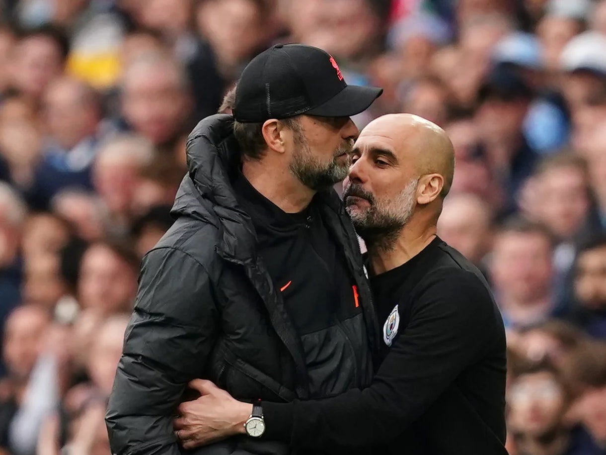 Liverpool boss Jurgen Klopp, left, will attempt to snatch the Premier League title from Pep Guardiola’s Manchester City