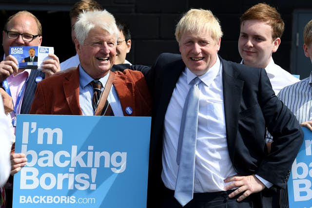 <p>Stanley and Boris Johnson at a hustings in Exeter during the 2019 Tory leadership election </p>